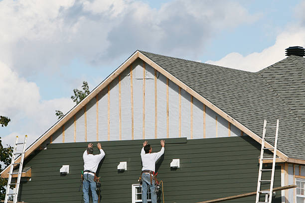 Professional Siding technician working in Union City, NJ